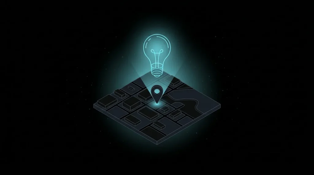 Light bulb shining down on a location pin on a map
